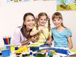 Child painting in preschool.