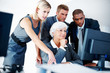 Worried business team looking at computer Worried business team looking at computer