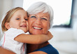 Girl hugging grandmother