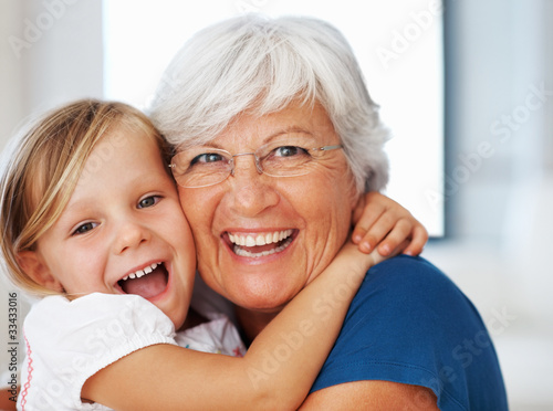 Photo: Girl embracing grandmother Girl embracing grandmother