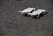 deck white plastic chairs on the beach