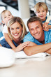 Happy family smiling at home