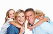 Photo: Couple smiling with two adorable children Couple smiling with two adorable children