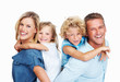 Happy couple smiling with two kids