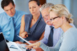 Photo: Business people having serious discussion Business people having serious discussion