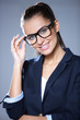 Foto: Portrait of pretty young business woman smiling Portrait of pretty young business woman smiling