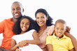 African American family of four smiling together