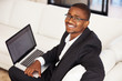 Photo: Smiling business man with laptop Smiling business man with laptop