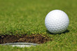 Golfball almost in the hole Golfball almost in the hole