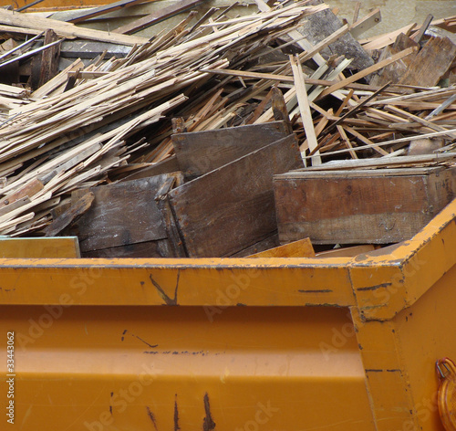 Photo: metal orange container filled with wood timber rubble metal orange container filled with wood timber rubble