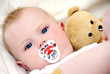 Foto: Baby with teddy and pacifier Baby with teddy and pacifier