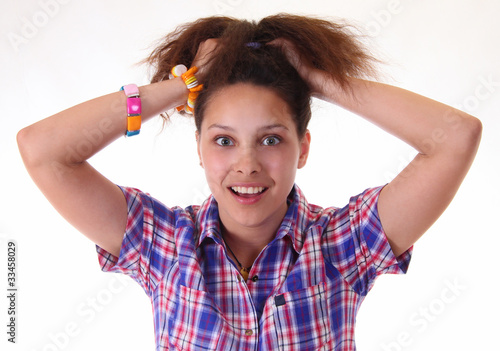 Photo: A funny young girl with bizarre hairstyle A funny young girl with bizarre hairstyle