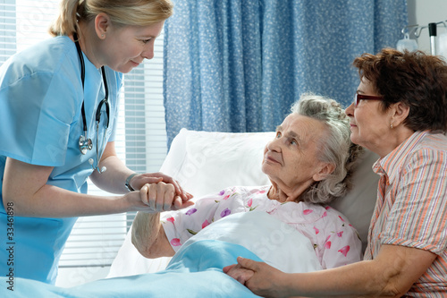 Photo: Senior patient is being visited by the daughter in hospital Senior patient is being visited by the daughter in hospital