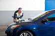 Man cleaning a car.
