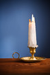 Photo: copy space candle on blue background copy space candle on blue background