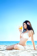 woman in bikini at sea beach