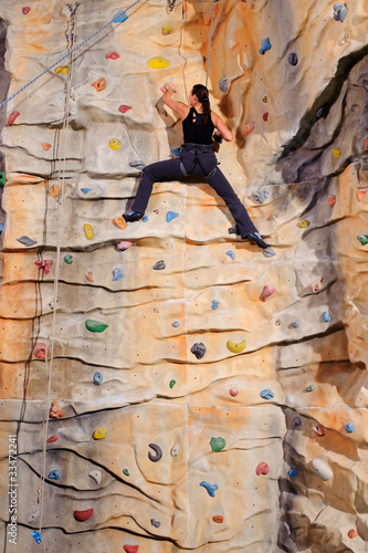 Photo: woman on rock wall woman on rock wall