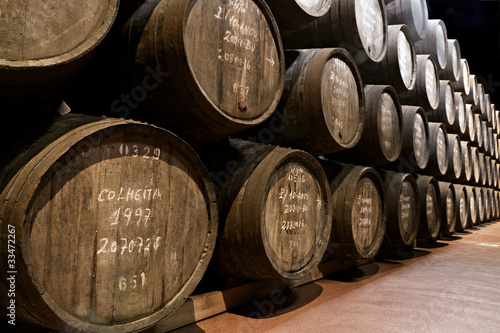 Photo: port wine ages in barrels in cellar port wine ages in barrels in cellar