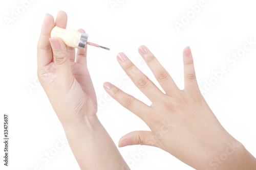 Photo: Close up view of painting nail on white background Close up view of painting nail on white background