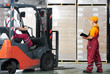 Photo: warehouse works (forklift and workers) warehouse works (forklift and workers)