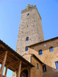 Upward view of an old medieval tower in San Gimignano, Italy