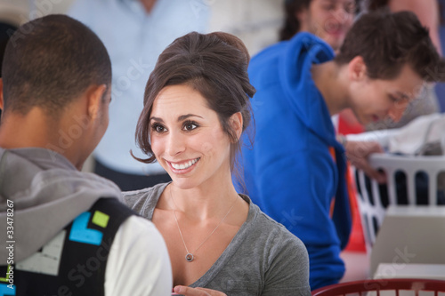 Photo: Smiling Woman In Laundromat Smiling Woman In Laundromat