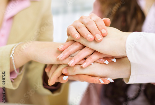 Foto: Image of business partners hands on top of each other Image of business partners hands on top of each other