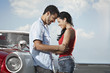 young man meeting beautiful woman and hugging