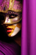Foto: portrait of woman in violet mask portrait of woman in violet mask