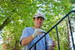 Man Painting Railing Black
