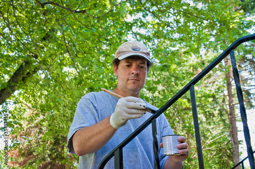 Photo: Man Painting Railing Black Man Painting Railing Black