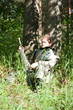 Knight sleeps under  tree