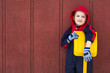 Young boy leans on his toy shovel Young boy leans on his toy shovel