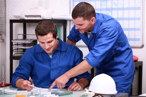 Photo: Manual workers in an office Manual workers in an office