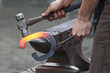Blacksmith forging a metal horseshoe