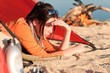 Camping happy woman relax in tent by campfire