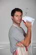 Man armed and dangerous with a kitchen whisk