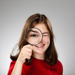 Girl holding magnifying glass Girl holding magnifying glass