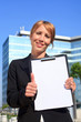 businesswoman holding a blank document