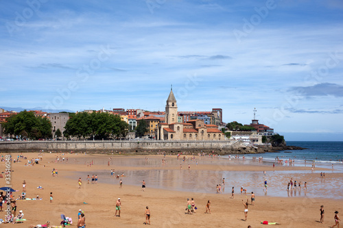 Photo: People in the beach of Gijon People in the beach of Gijon