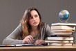 Photo: Checking the globe a teenage girl doing homework Checking the globe a teenage girl doing homework