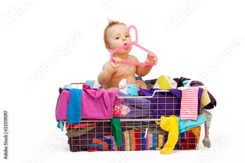 Photo: Baby in clothes and hanger Baby in clothes and hanger