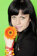 woman holds gerbera