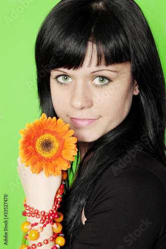 Photo: woman holds gerbera woman holds gerbera