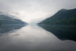 Photo: mist over the water and mountains mist over the water and mountains