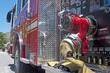 Gauges and hose of a firetruck, close up. Gauges and hose of a firetruck, close up.