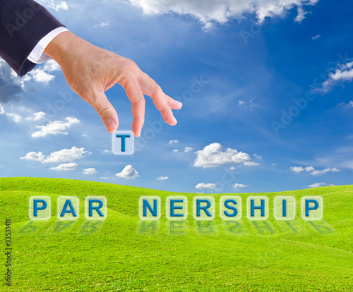 Photo: business man hand and partnership word business man hand and partnership word