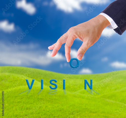 Photo: business man hand and vision word business man hand and vision word