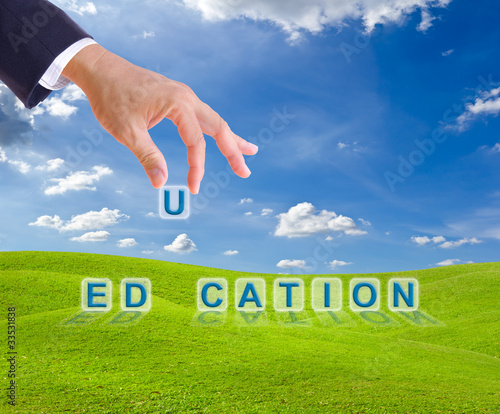 Photo: business man hand made education word buttons business man hand made education word buttons