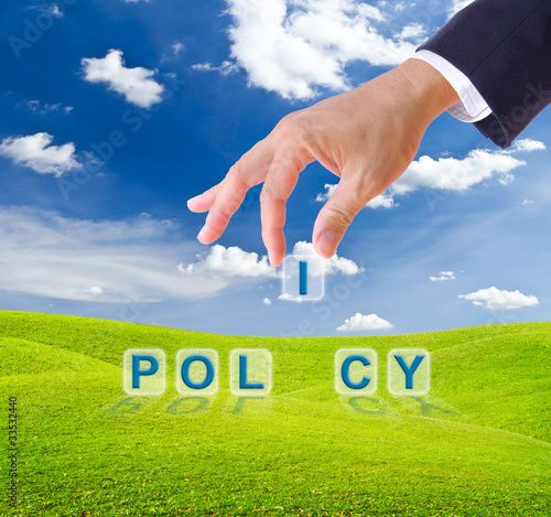 Photo: business man hand made policy word buttons business man hand made policy word buttons